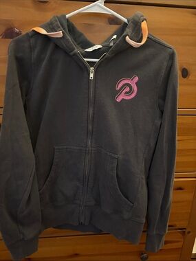 Peloton Hooded Zip Sweatshirt in Charcoal with Pink Logo and Peach Trim